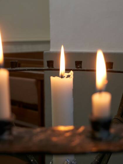 Three lighted candles